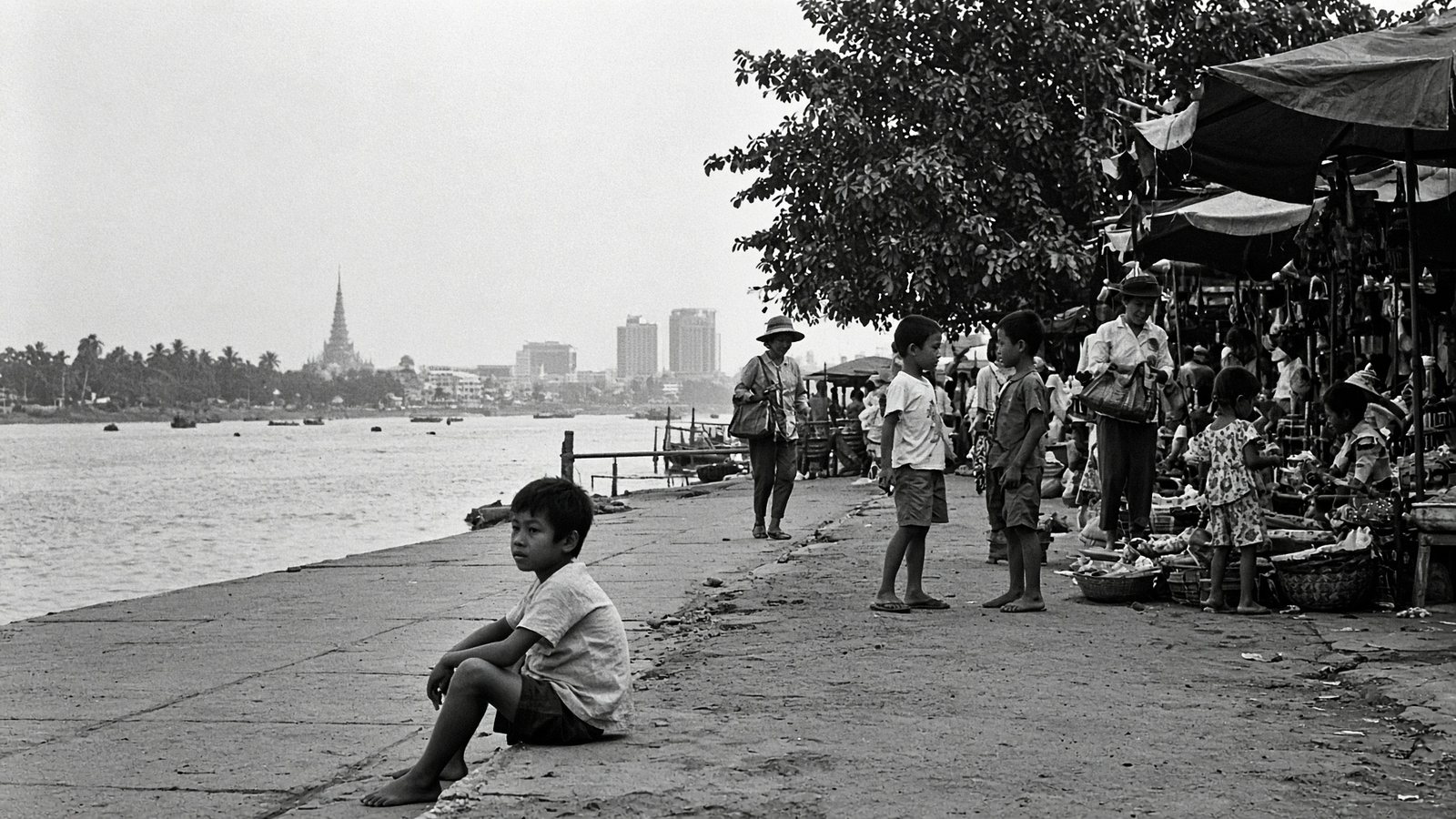 A boy sitting on the quay